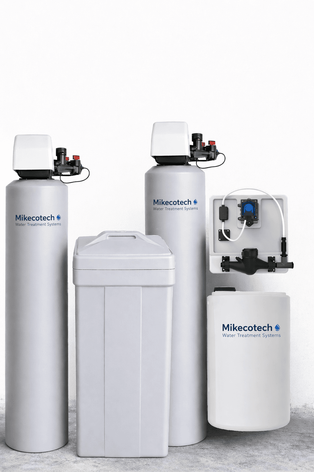 Mikecotech water treatment system with tall grey tanks, a brine tank, and a pump.