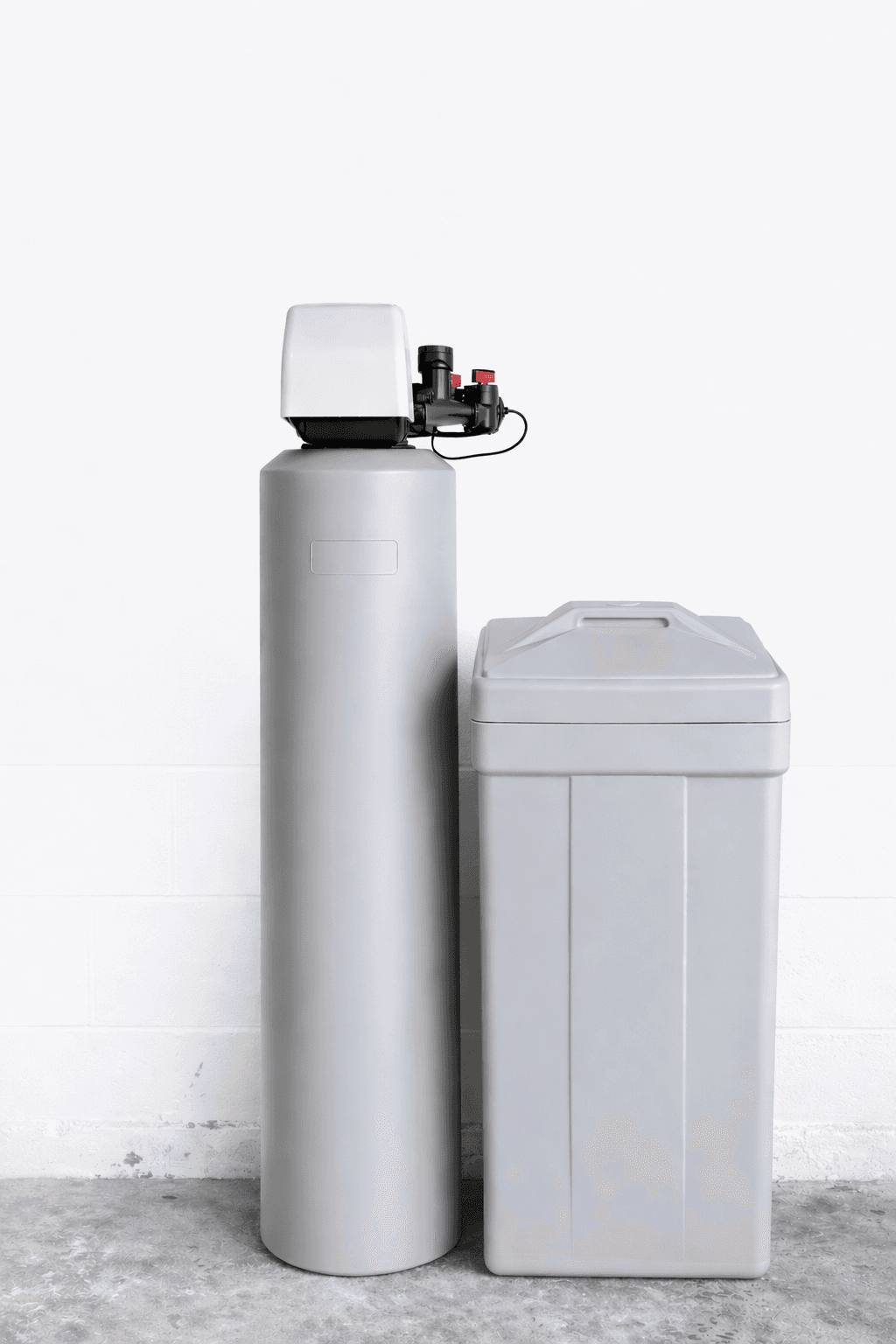 Grey water softener system with a tall cylindrical tank and a rectangular brine tank.